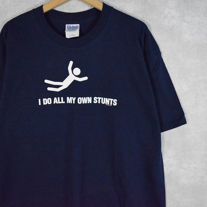 画像1: 90〜2000's "I DO ALL MY OWN STUNTS" シュールイラストプリントTシャツ NAVY XL (1)